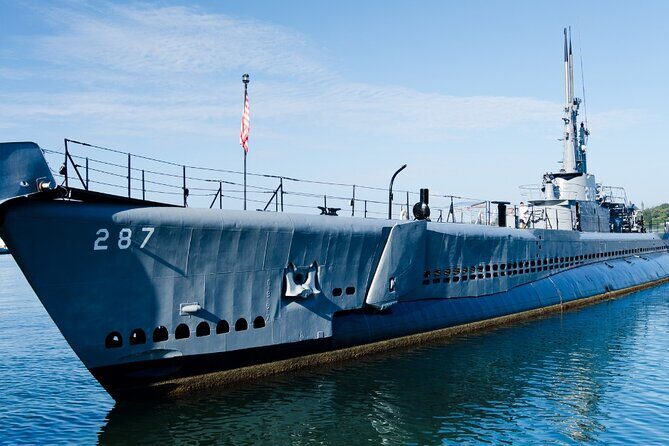 Exclusive Pearl Harbor and USS Arizona All-Access Private Tour - Downtown Honolulu between monuments: Aloha Tower, Iolani Palace, and the Eternal Flame