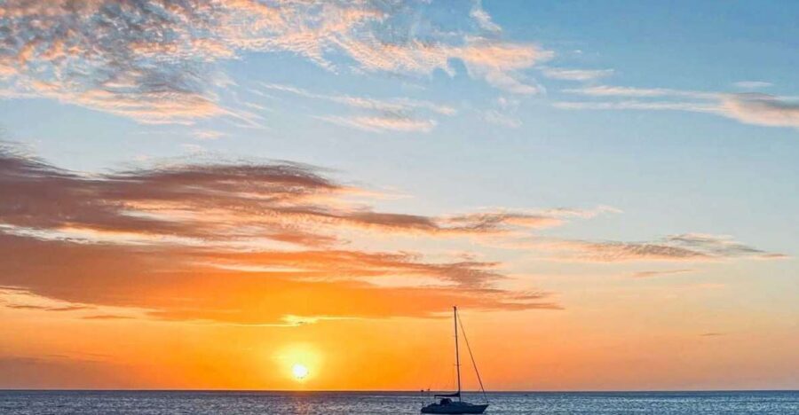 Oahu: Sunset sailing in small intimate groups - Golden hour views: city lights, moonrise, and Diamond Head in frame